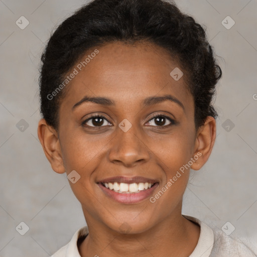 Joyful black young-adult female with short  brown hair and brown eyes