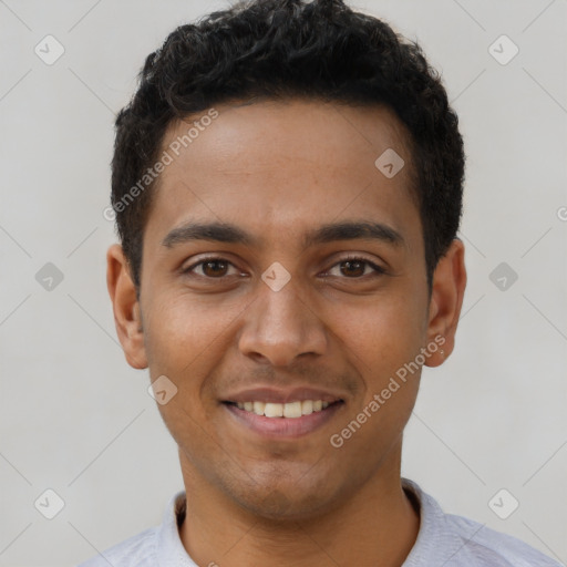 Joyful latino young-adult male with short  brown hair and brown eyes