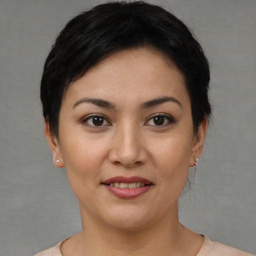 Joyful white young-adult female with short  black hair and brown eyes