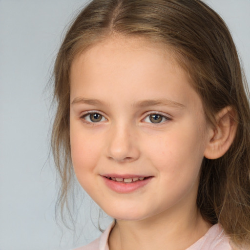 Joyful white child female with medium  brown hair and brown eyes