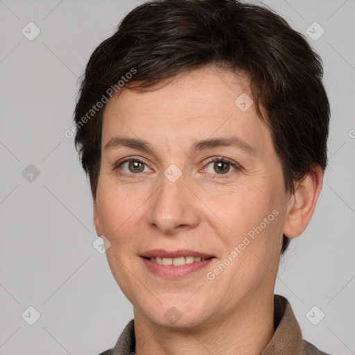 Joyful white adult female with short  brown hair and grey eyes