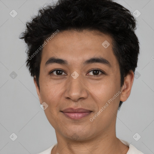 Joyful latino young-adult male with short  brown hair and brown eyes