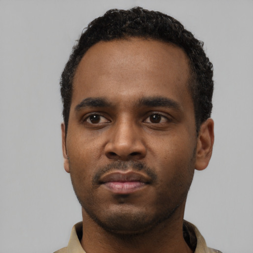 Neutral black young-adult male with short  black hair and brown eyes