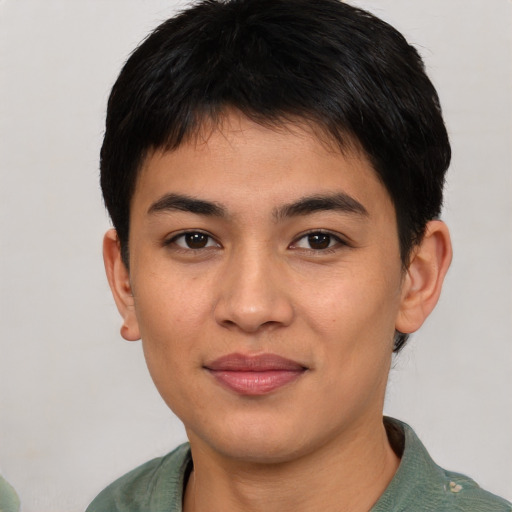 Joyful asian young-adult male with short  brown hair and brown eyes