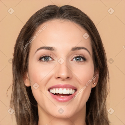 Joyful white young-adult female with long  brown hair and brown eyes