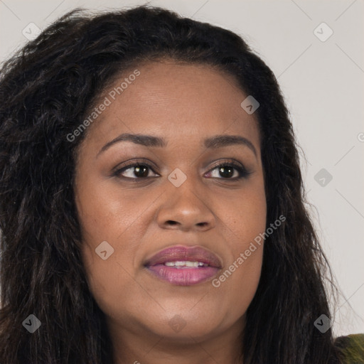 Joyful black young-adult female with long  brown hair and brown eyes