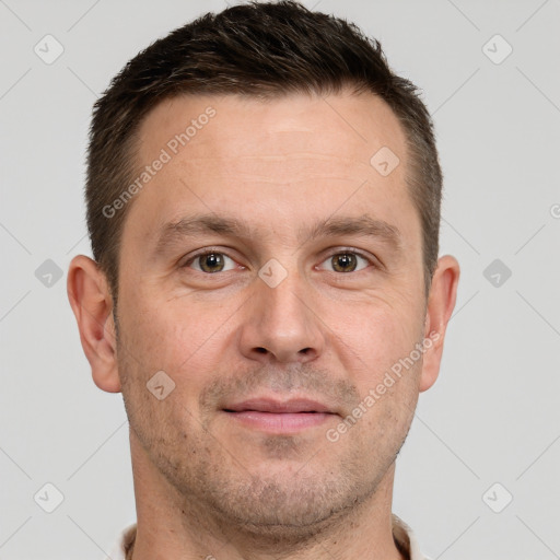 Joyful white adult male with short  brown hair and grey eyes