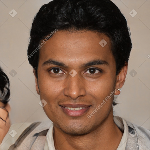 Joyful latino young-adult male with short  brown hair and brown eyes