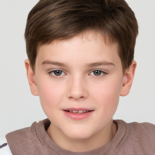 Joyful white child male with short  brown hair and brown eyes