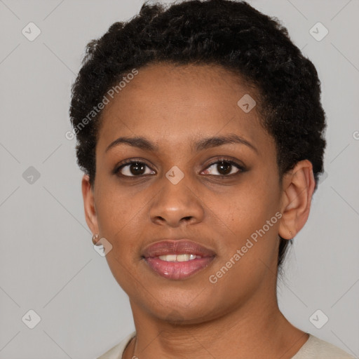 Joyful black young-adult female with short  brown hair and brown eyes