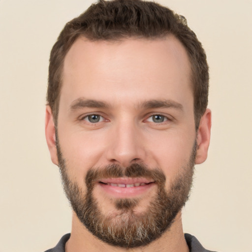 Joyful white young-adult male with short  brown hair and brown eyes