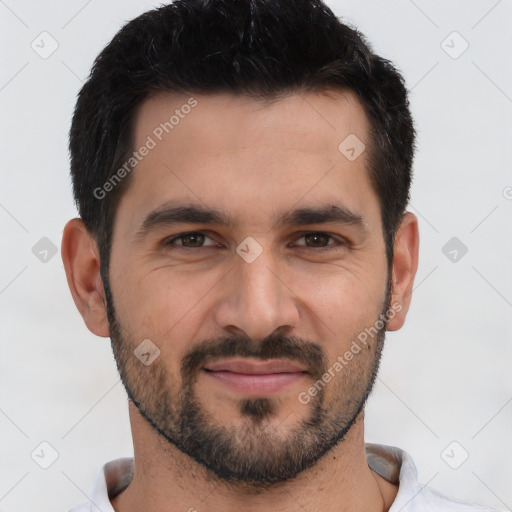 Joyful white young-adult male with short  black hair and brown eyes