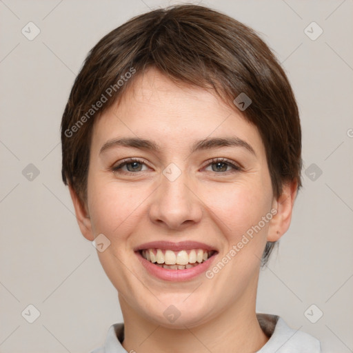 Joyful white young-adult female with short  brown hair and grey eyes