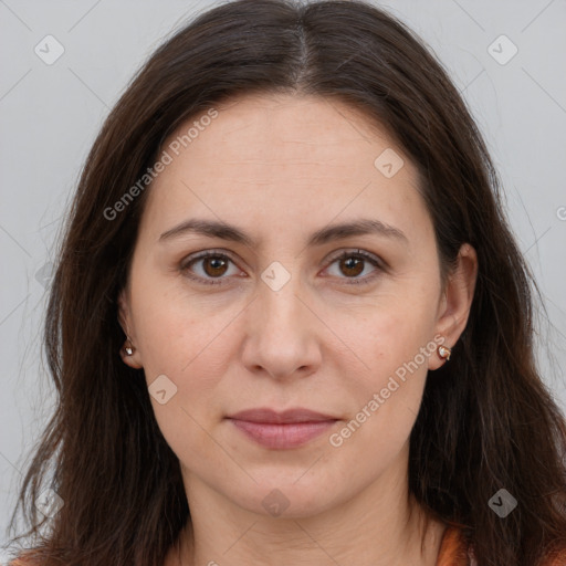 Joyful white adult female with long  brown hair and brown eyes