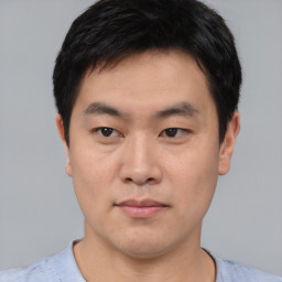 Neutral asian young-adult male with short  black hair and brown eyes