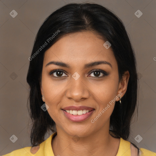 Joyful black young-adult female with medium  brown hair and brown eyes