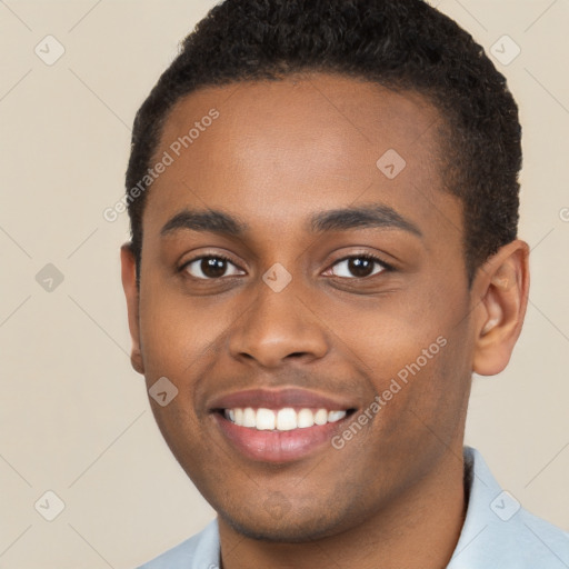 Joyful black young-adult male with short  brown hair and brown eyes