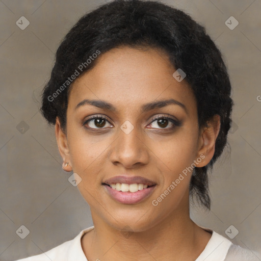 Joyful black young-adult female with short  brown hair and brown eyes