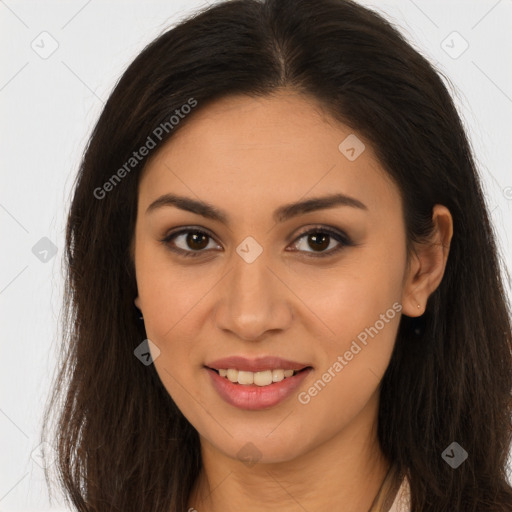 Joyful latino young-adult female with long  brown hair and brown eyes