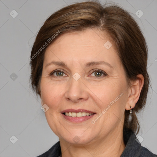 Joyful white adult female with medium  brown hair and grey eyes