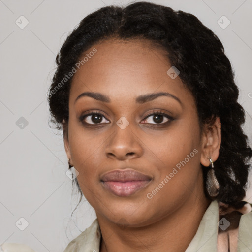 Joyful black young-adult female with long  brown hair and brown eyes