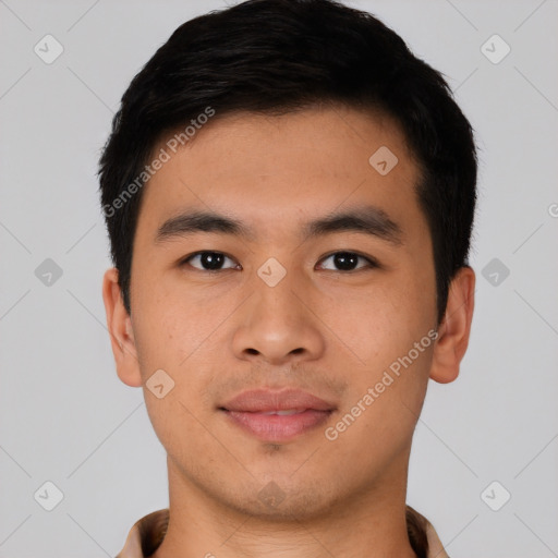 Joyful asian young-adult male with short  black hair and brown eyes