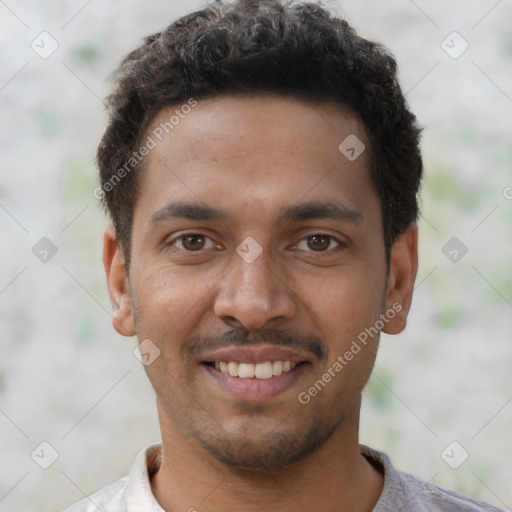 Joyful latino young-adult male with short  brown hair and brown eyes