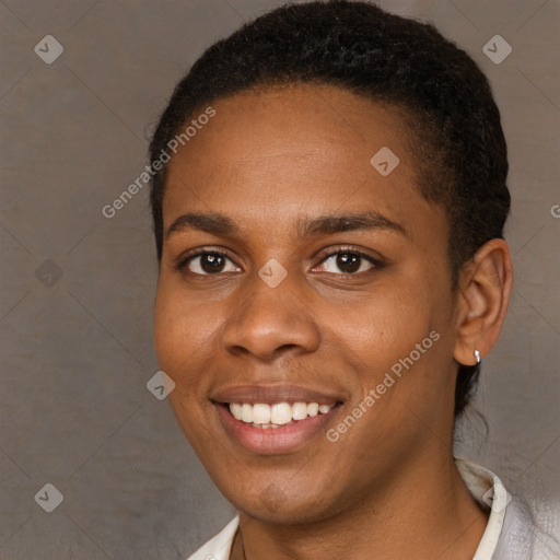 Joyful black young-adult female with short  brown hair and brown eyes