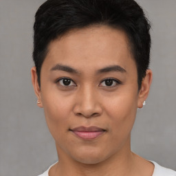 Joyful asian young-adult female with short  black hair and brown eyes