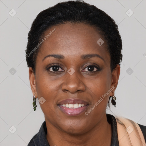 Joyful black young-adult female with short  brown hair and brown eyes