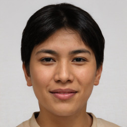 Joyful asian young-adult female with short  brown hair and brown eyes