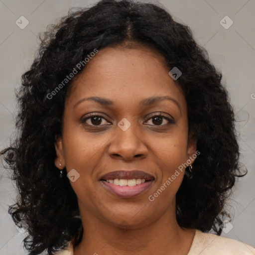 Joyful black young-adult female with long  brown hair and brown eyes