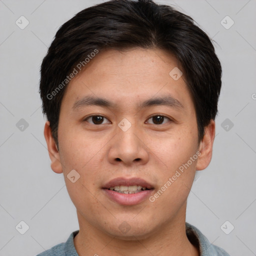 Joyful asian young-adult male with short  brown hair and brown eyes