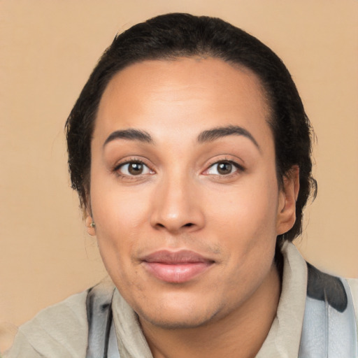 Joyful latino young-adult female with medium  black hair and brown eyes