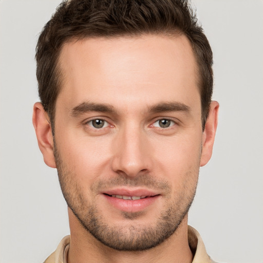 Joyful white young-adult male with short  brown hair and brown eyes