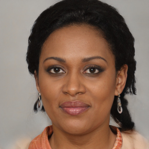 Joyful black young-adult female with medium  black hair and brown eyes