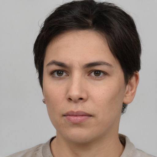 Neutral white young-adult female with short  brown hair and brown eyes