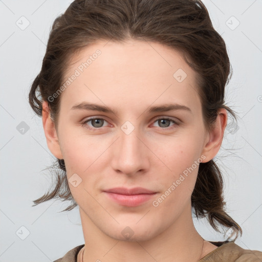 Joyful white young-adult female with medium  brown hair and grey eyes