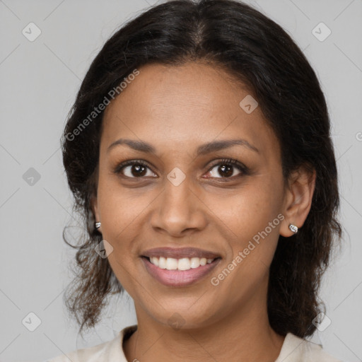 Joyful black young-adult female with medium  brown hair and brown eyes