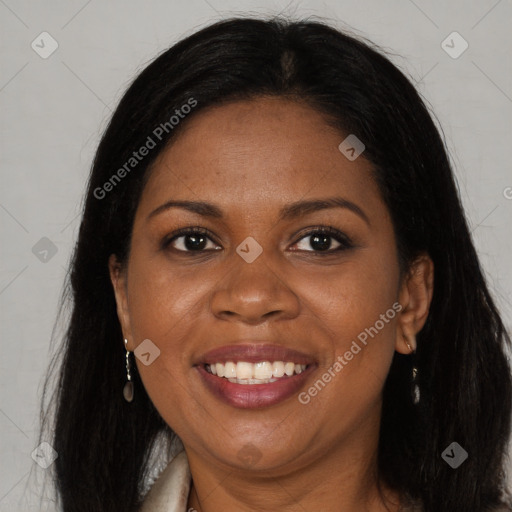 Joyful black young-adult female with long  brown hair and brown eyes