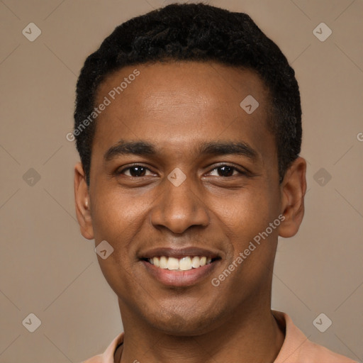 Joyful black young-adult male with short  black hair and brown eyes