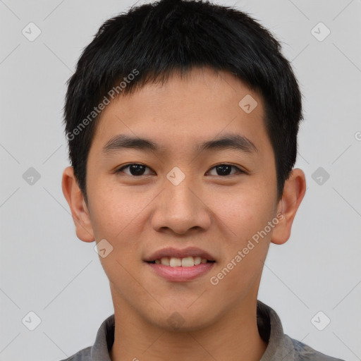 Joyful asian young-adult male with short  black hair and brown eyes