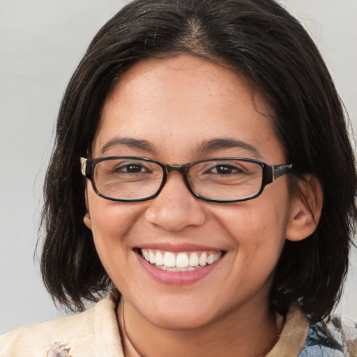 Joyful white young-adult female with medium  brown hair and brown eyes