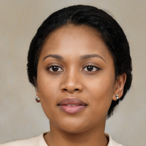 Joyful latino young-adult female with short  black hair and brown eyes