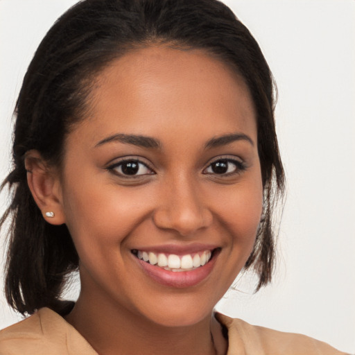 Joyful latino young-adult female with medium  brown hair and brown eyes