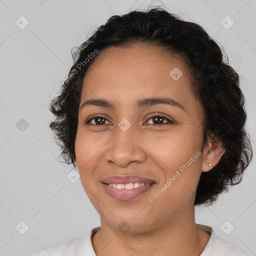 Joyful latino young-adult female with short  black hair and brown eyes