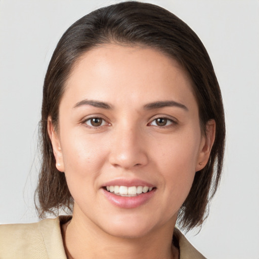 Joyful white young-adult female with medium  brown hair and brown eyes