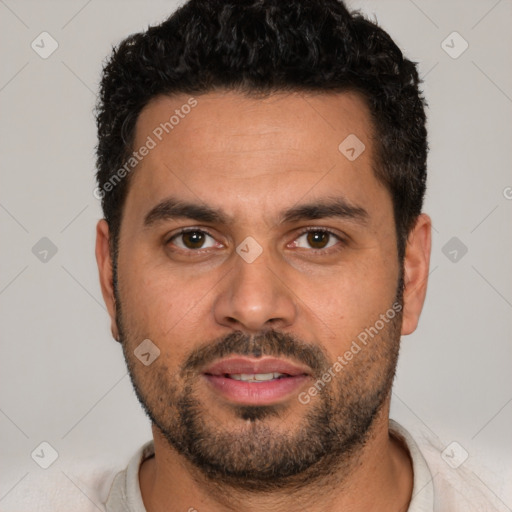 Joyful white young-adult male with short  black hair and brown eyes