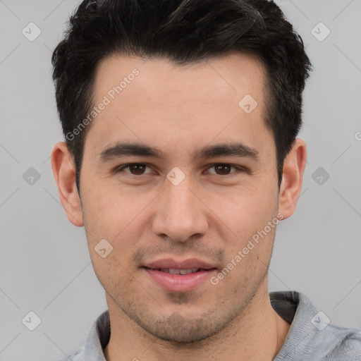 Joyful white young-adult male with short  black hair and brown eyes