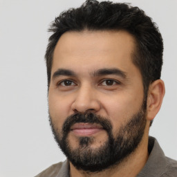 Neutral latino young-adult male with short  black hair and brown eyes